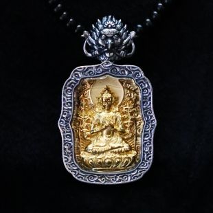 Pure silver. Pendant (Four-armed Avalokiteshvara)